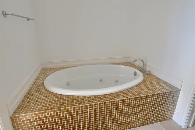 a view of a balcony with wooden fence