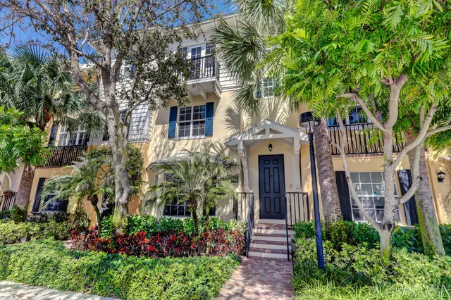 front view of a house with a garden