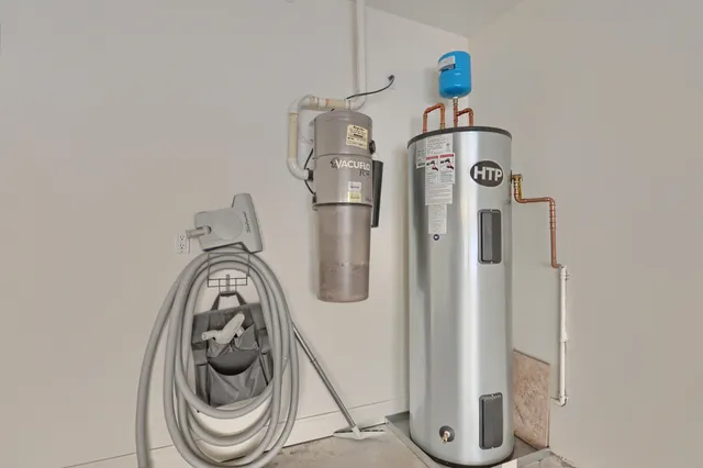 an aerial view of a house with a garden and a car parking space