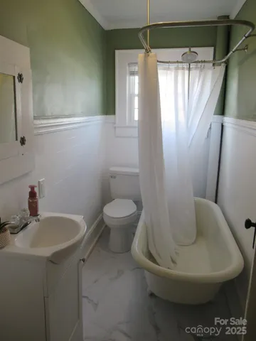 a bathroom with a toilet and a sink