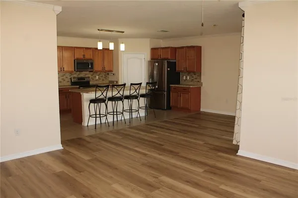 a view of a kitchen with a sink and cabinets