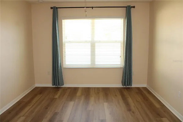 a view of a room that has a window in it
