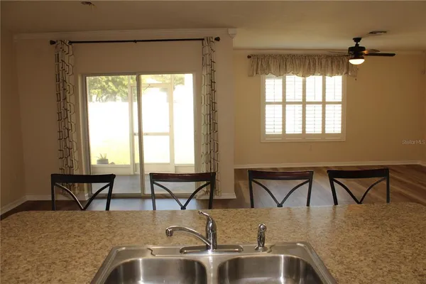 a dining room with table and chairs