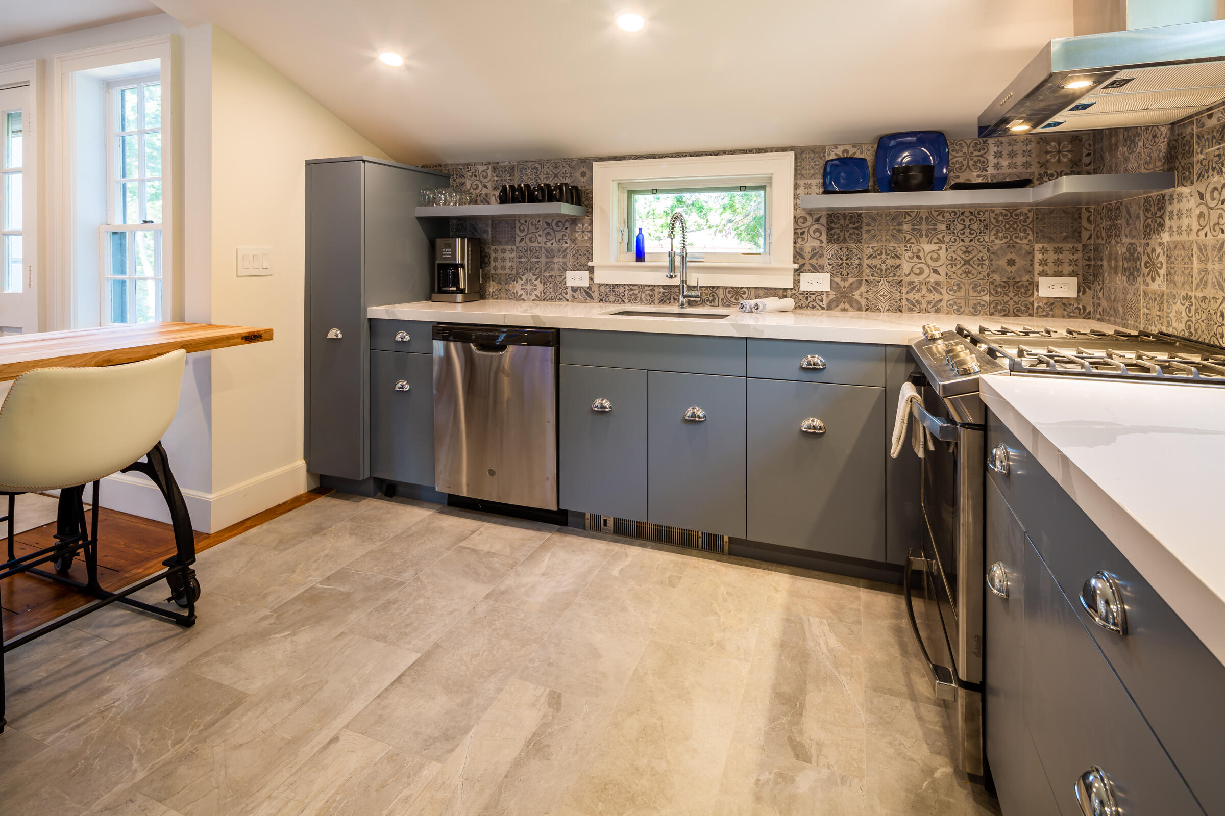 591 Crowell Road North Chatham, MA 02633 - Photo 10 of 58 a kitchen with a stove a sink and a refrigerator