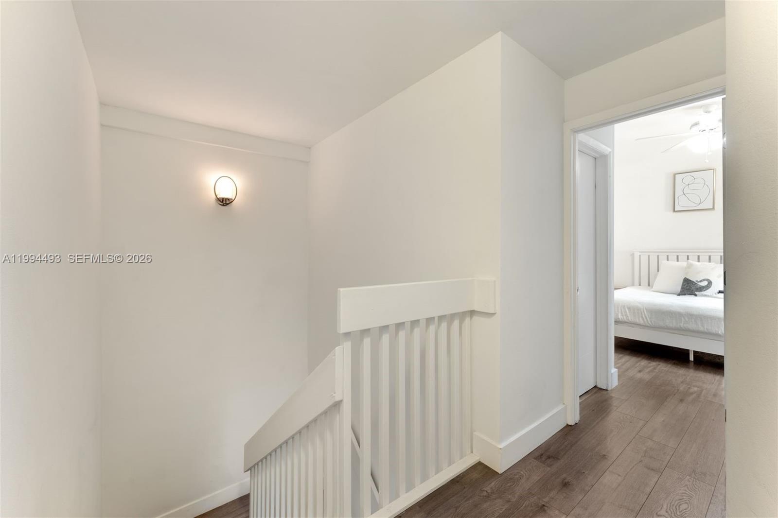 13235 Southwest 114th Terrace Miami, FL 33186 - Photo 17 of 26 a view of a bedroom from a hallway
