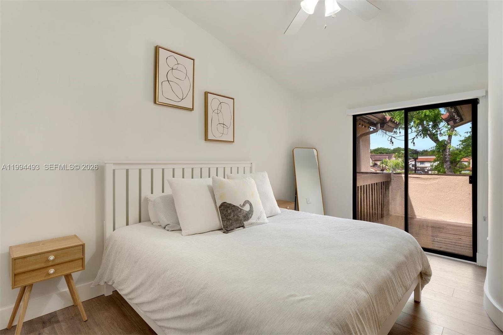 13235 Southwest 114th Terrace Miami, FL 33186 - Photo 18 of 26 a bedroom with a large bed and a window