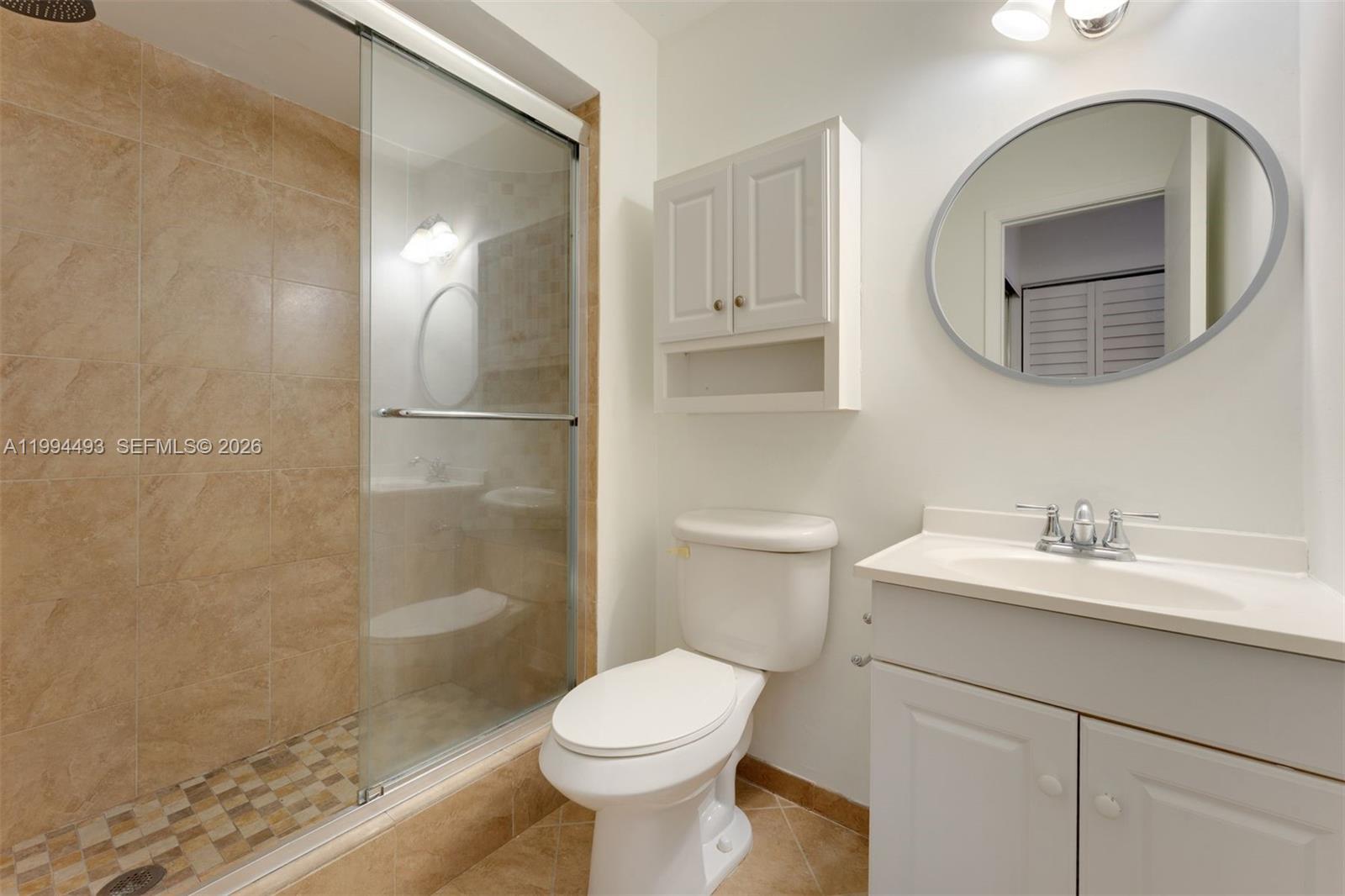13235 Southwest 114th Terrace Miami, FL 33186 - Photo 26 of 26 a bathroom with a sink toilet and shower