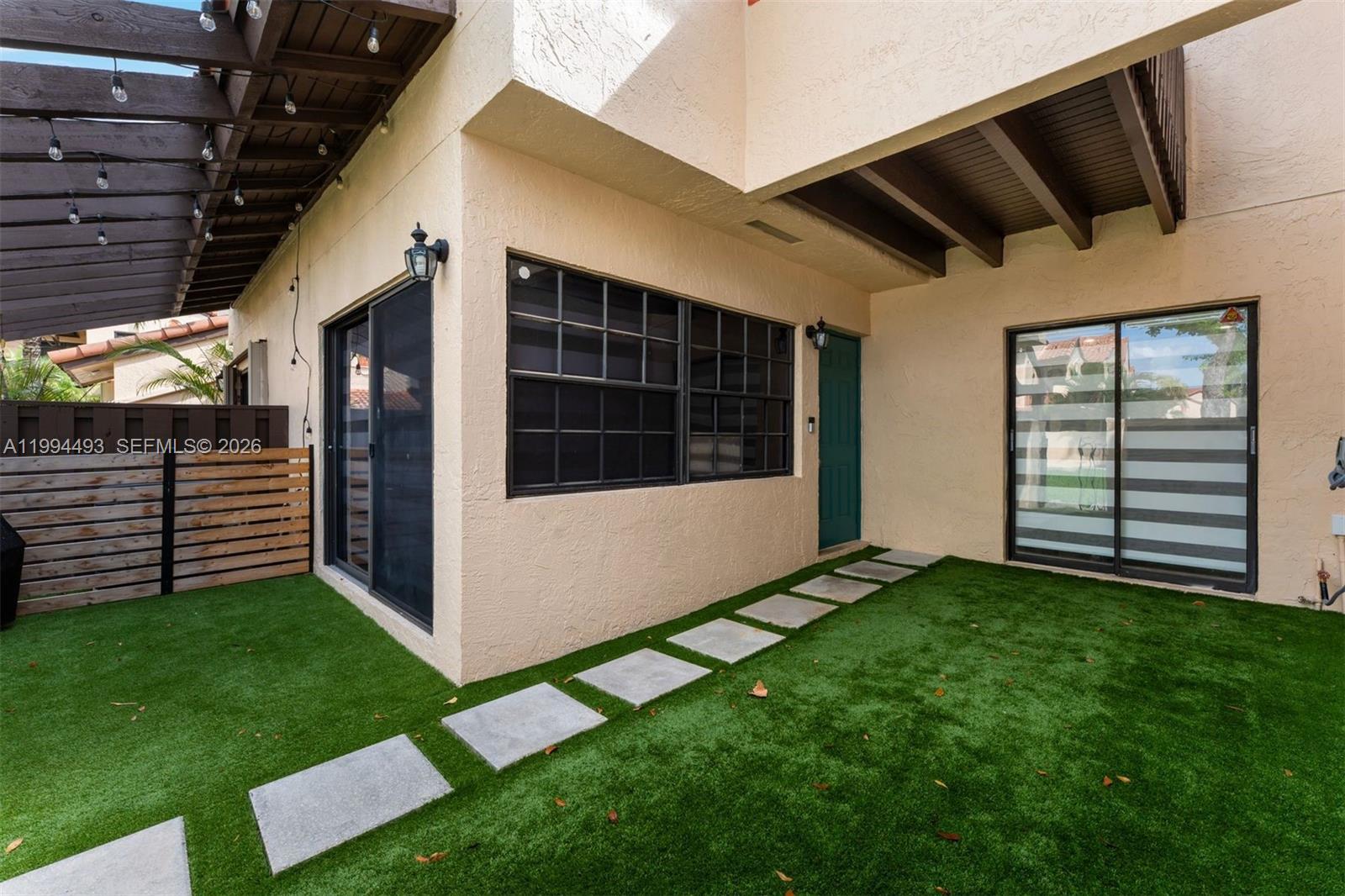 13235 Southwest 114th Terrace Miami, FL 33186 - Photo 3 of 26 a view of a porch in front of house
