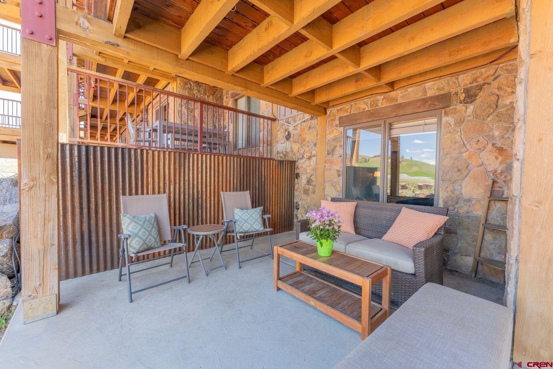 72 Hunter Hill Road, Unit I103 Crested Butte, CO 81225 - Photo 27 of 35 a outdoor living space with furniture and a ceiling fan
