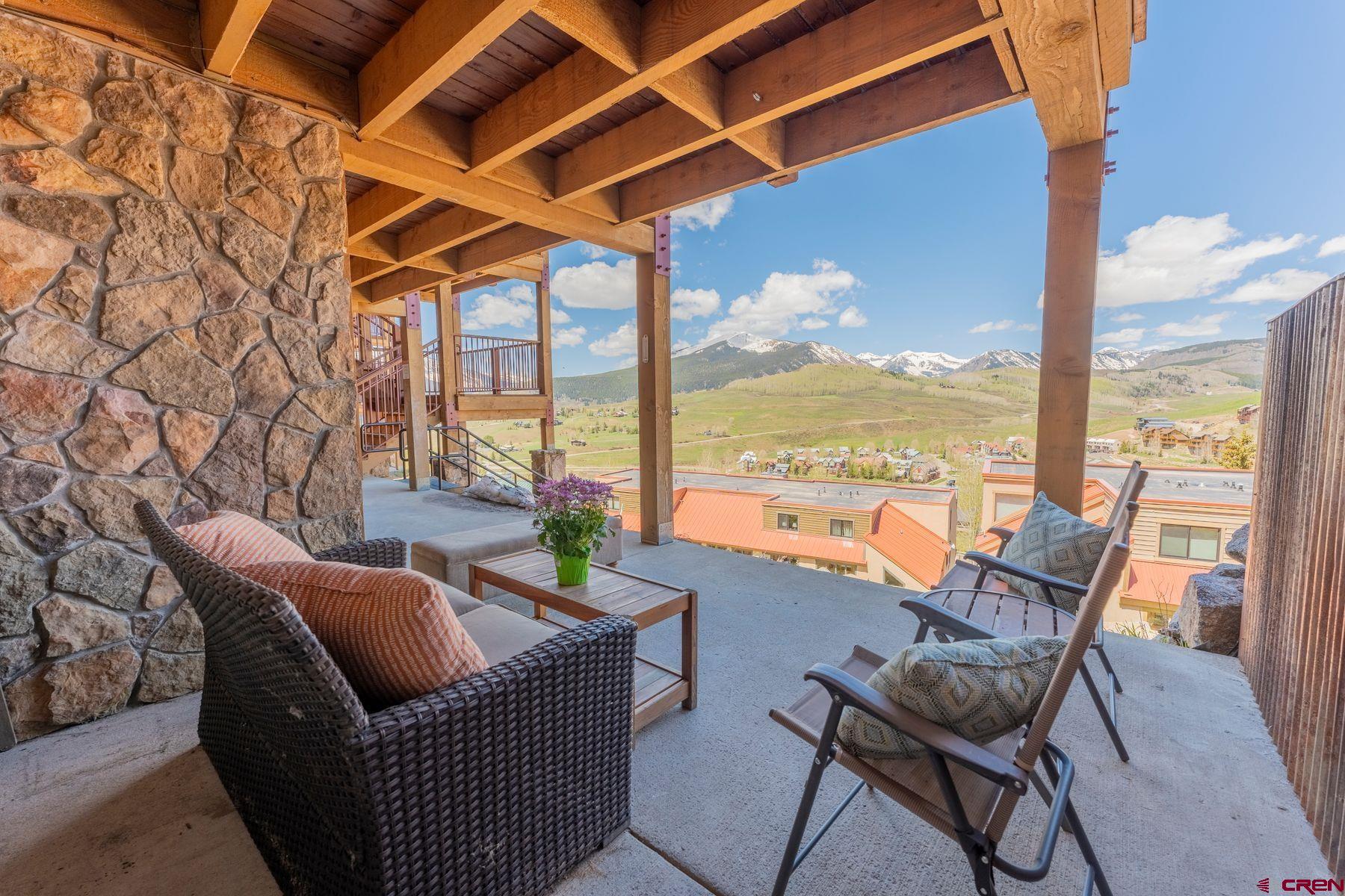 72 Hunter Hill Road, Unit I103 Crested Butte, CO 81225 - Photo 28 of 35 a balcony with furniture and outdoor view