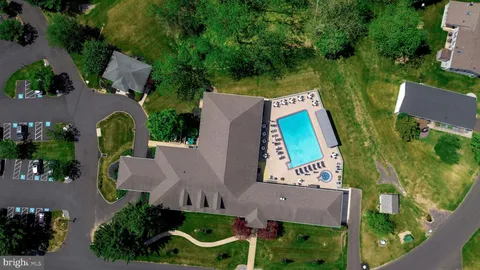 an aerial view of house with yard swimming pool and outdoor seating