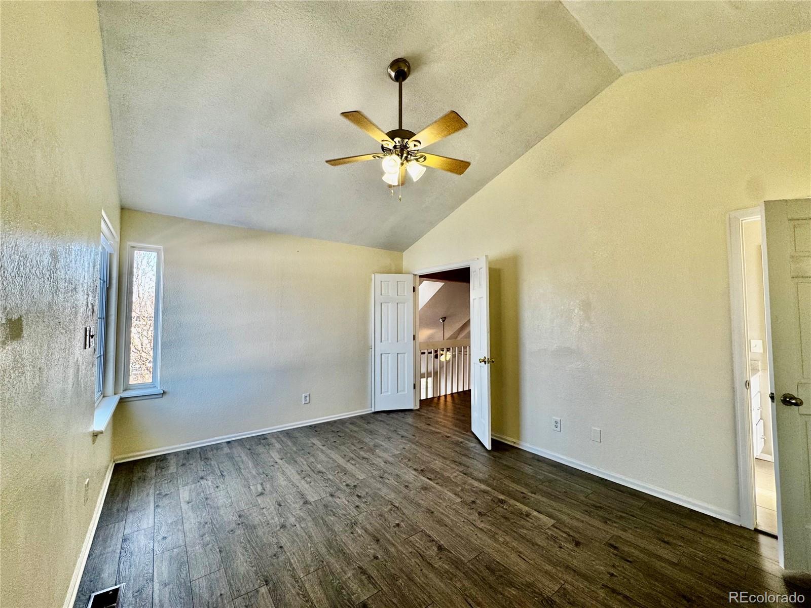 3615 South Flanders Street Aurora, CO 80013 - Photo 13 of 30 wooden floor in an empty room with a window