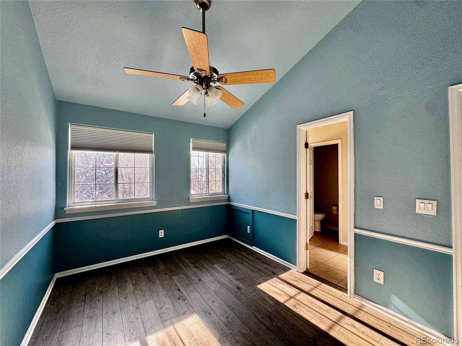 3615 South Flanders Street Aurora, CO 80013 - Photo 14 of 30 a room with window and a wooden floor