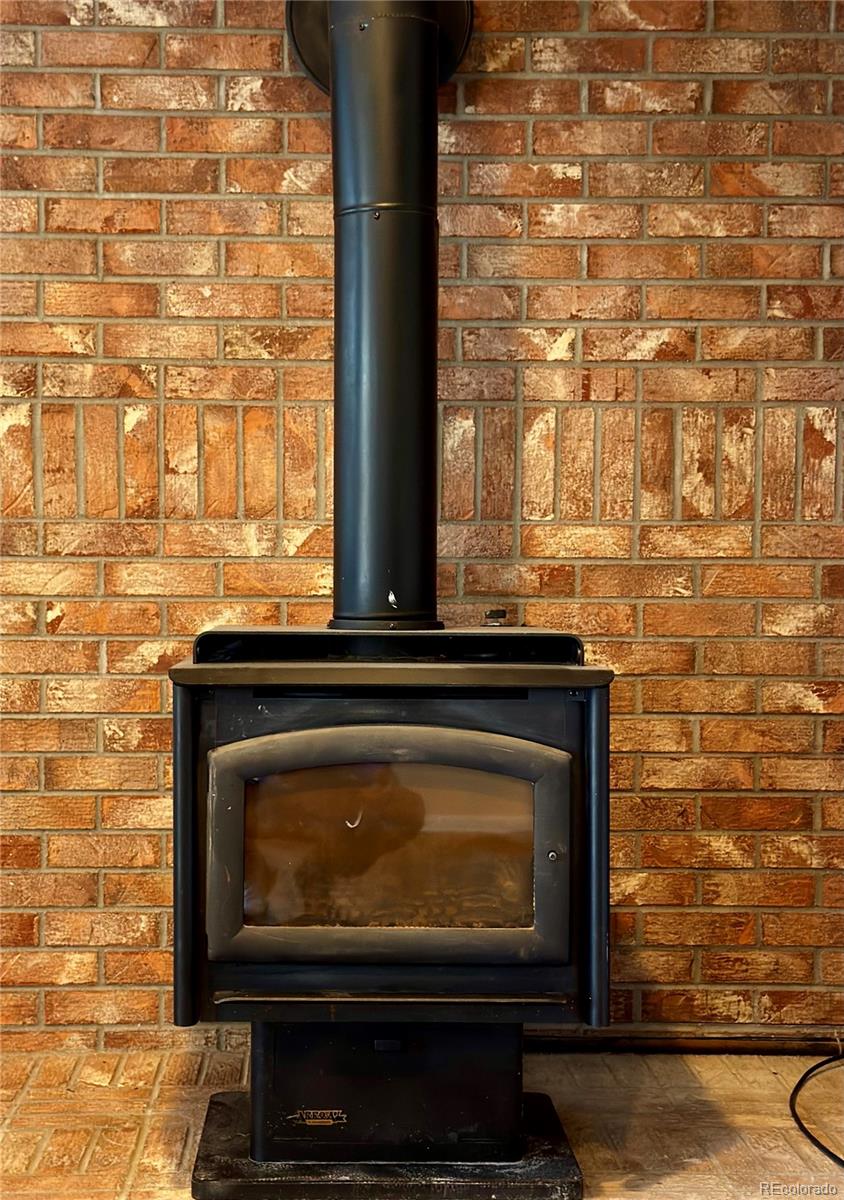 3615 South Flanders Street Aurora, CO 80013 - Photo 17 of 30 a stove top oven sitting inside of a kitchen