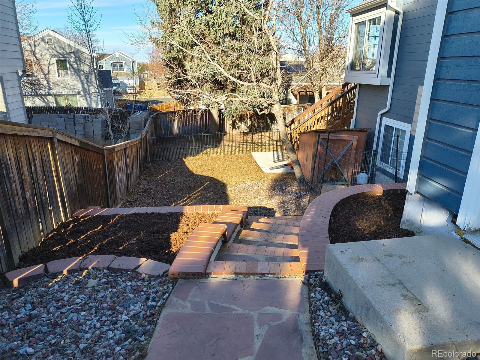 3615 South Flanders Street Aurora, CO 80013 - Photo 21 of 30 a view of a patio with table and chairs
