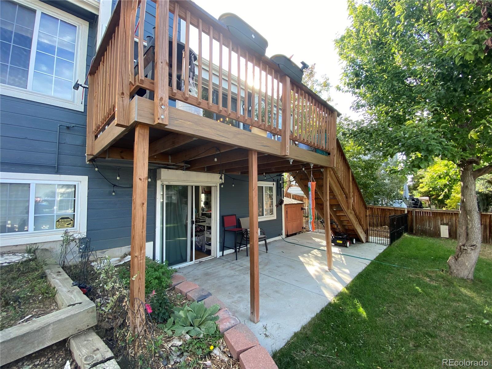3615 South Flanders Street Aurora, CO 80013 - Photo 25 of 30 a view of a house with a yard porch and sitting area