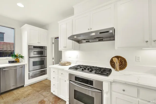 a workspace with wooden floor and a window
