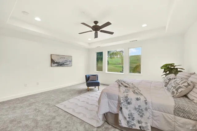 a view of a brick building next to a yard