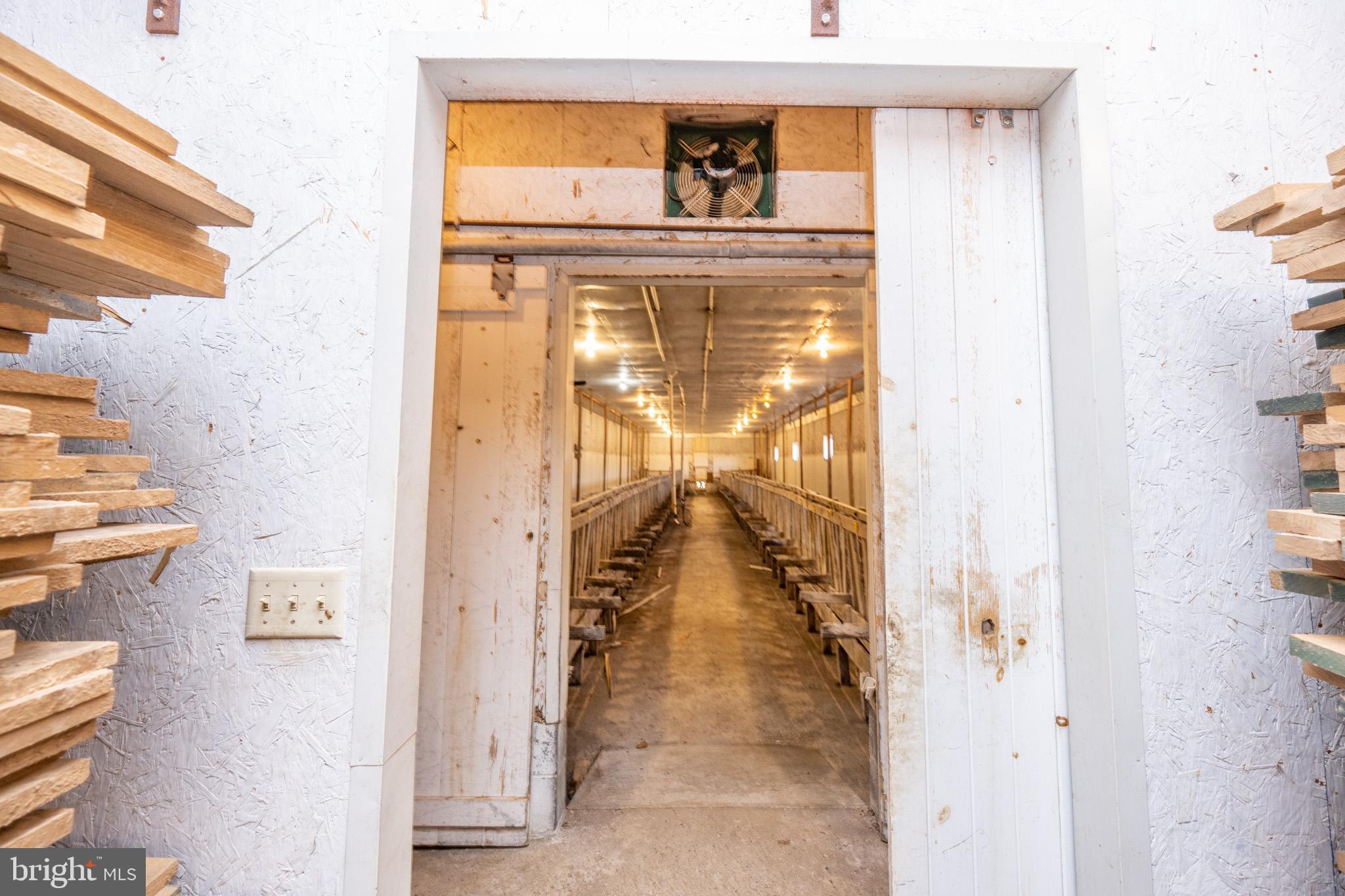 616 Crab Run Road Grantsville, MD 21536 - Photo 34 of 43 a hallway with sliding door and a view of bathroom