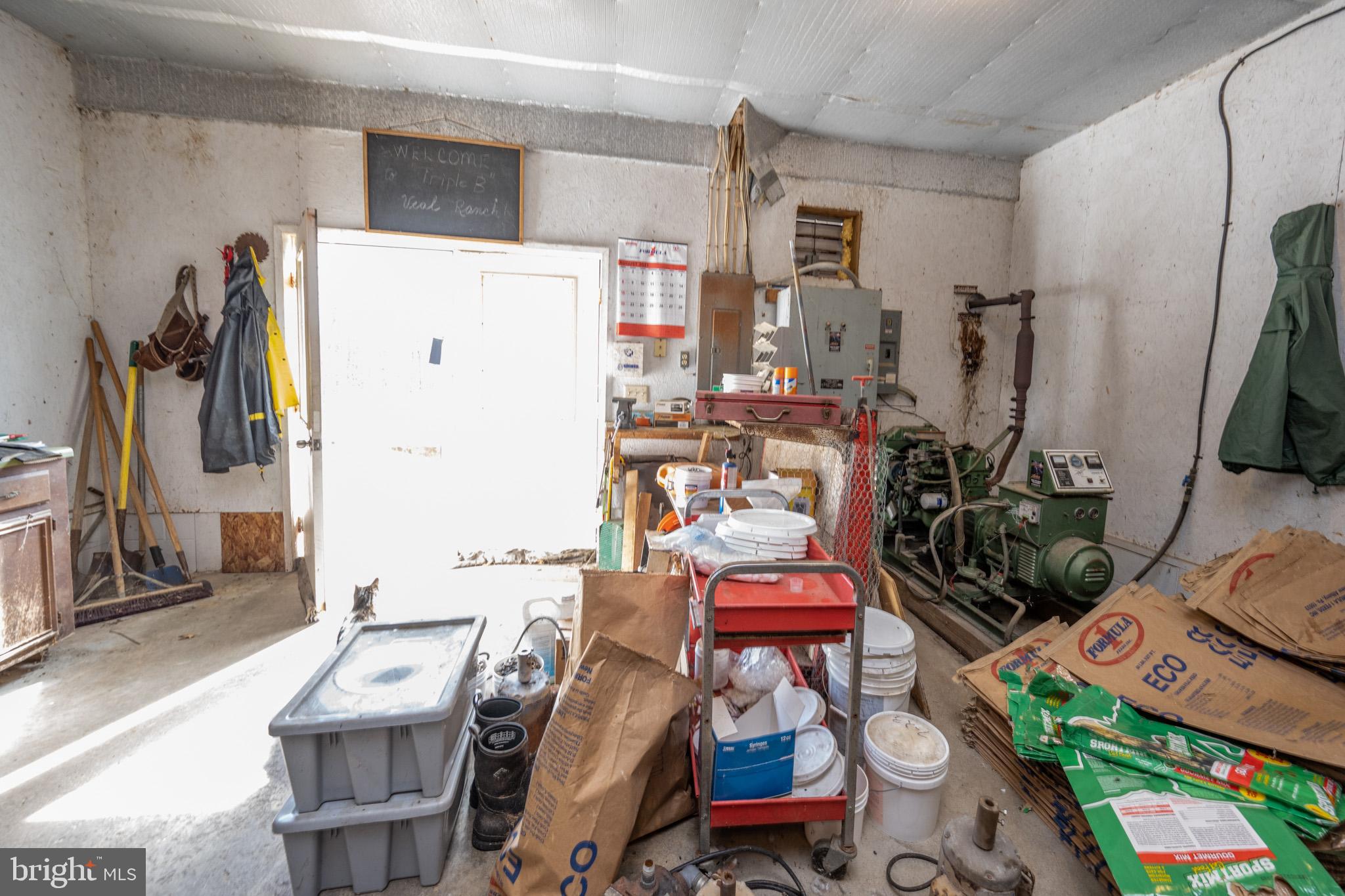 616 Crab Run Road Grantsville, MD 21536 - Photo 41 of 43 a room with furniture a rug and a flat screen tv