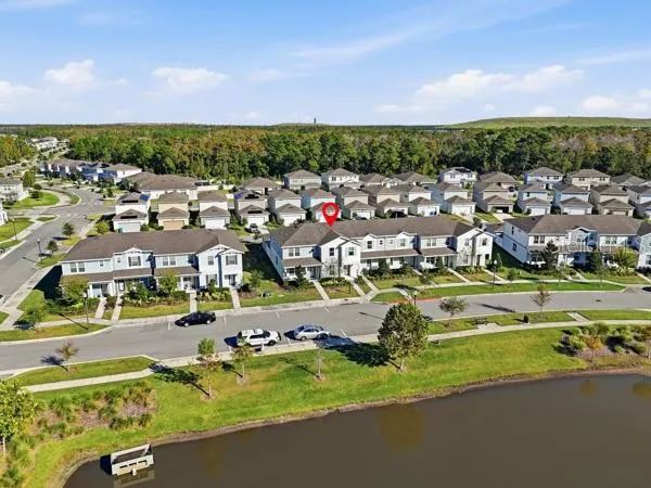 a park bench sitting in the middle of a park with large trees