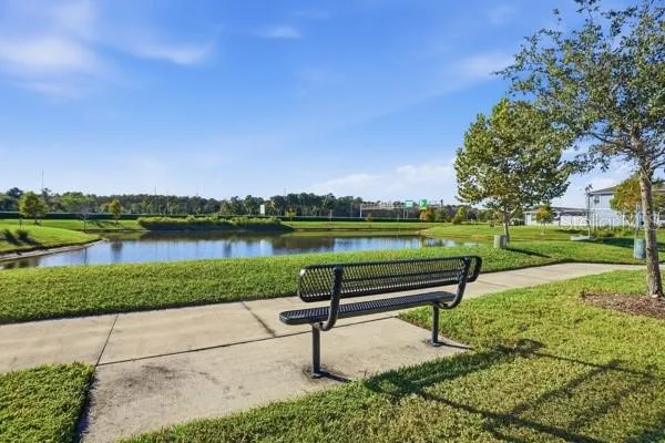 a kitchen with stainless steel appliances granite countertop a stove a refrigerator and a sink