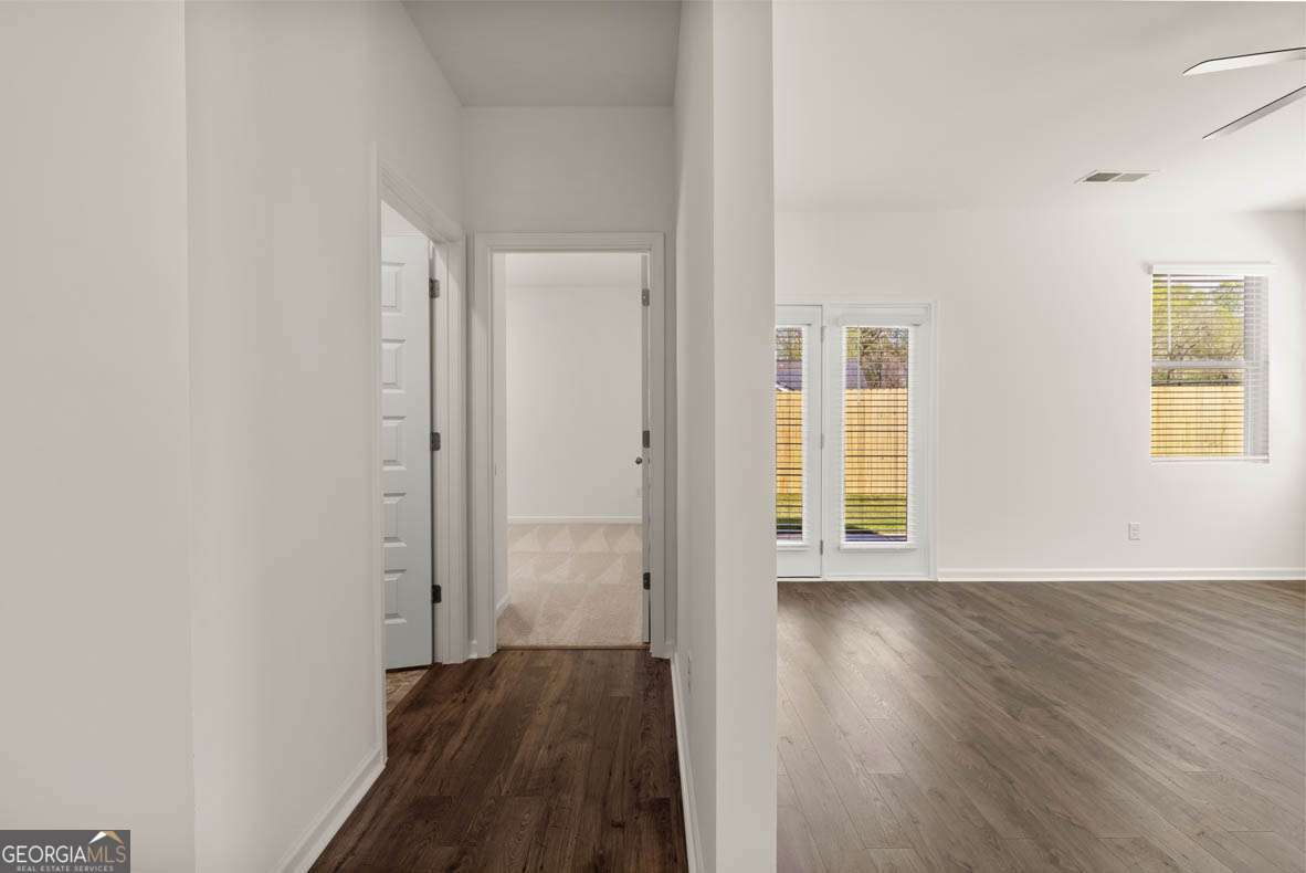 6010 Knickerbocker Street, Unit 135 Mableton, GA 30126 - Photo 11 of 17 wooden floor in an empty room