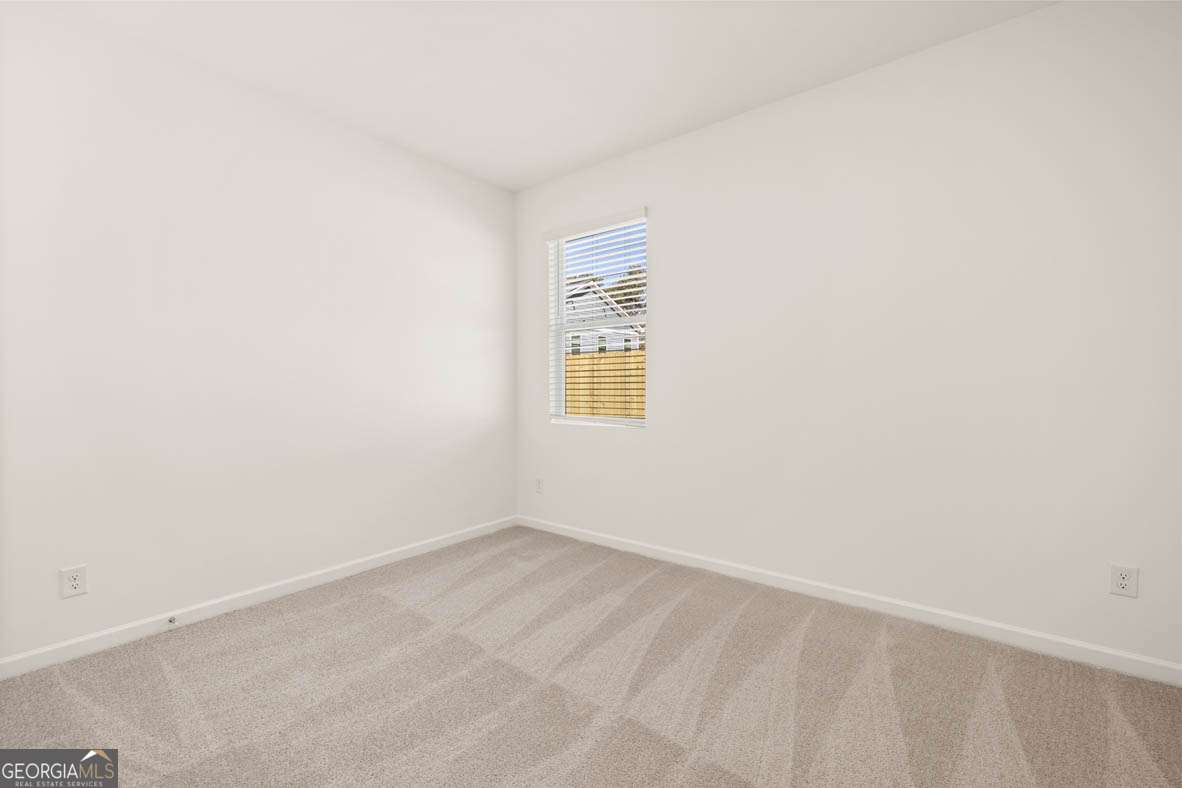 6010 Knickerbocker Street, Unit 135 Mableton, GA 30126 - Photo 12 of 17 a view of an empty room with a window
