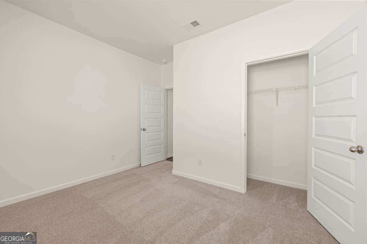 6010 Knickerbocker Street, Unit 135 Mableton, GA 30126 - Photo 13 of 17 a view of an empty room