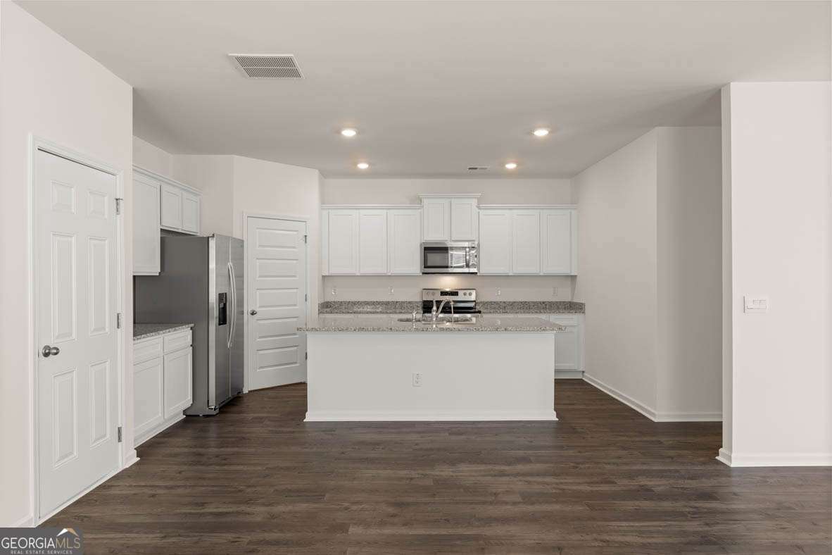 6010 Knickerbocker Street, Unit 135 Mableton, GA 30126 - Photo 17 of 17 a view of kitchen with wooden floor