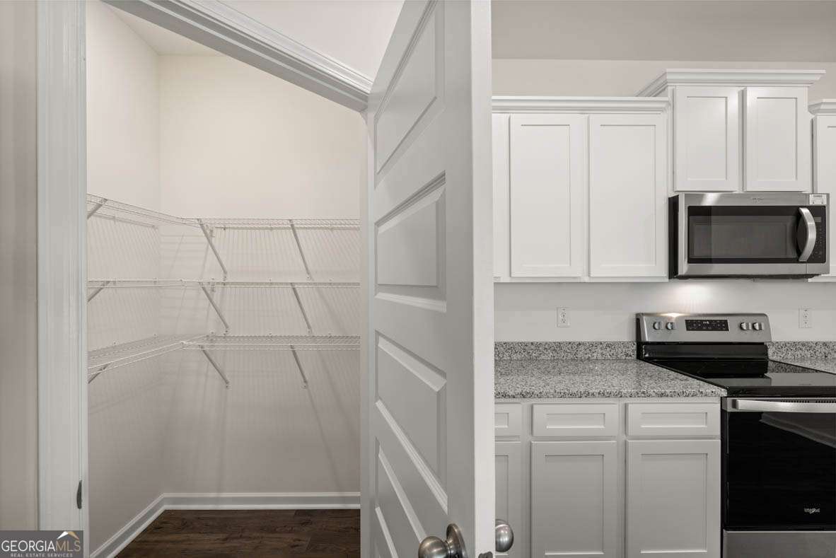 6010 Knickerbocker Street, Unit 135 Mableton, GA 30126 - Photo 5 of 17 a kitchen with a sink and cabinets