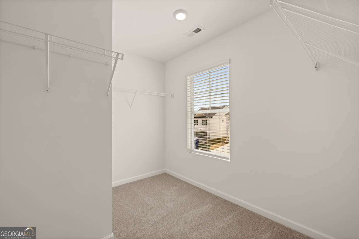 6010 Knickerbocker Street, Unit 135 Mableton, GA 30126 - Photo 8 of 17 a view of an empty room with a window