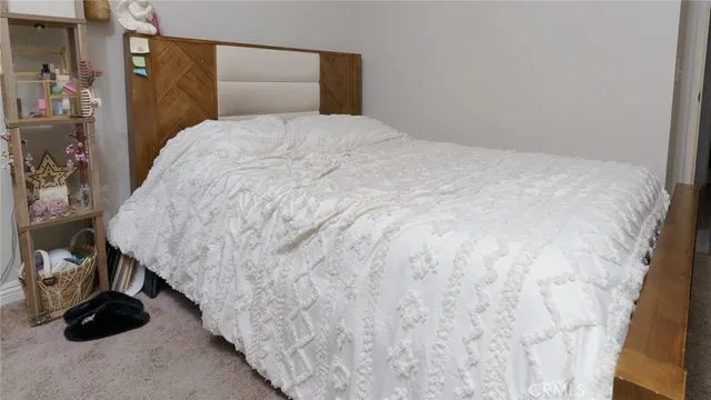 a bedroom with a bed and gym equipment