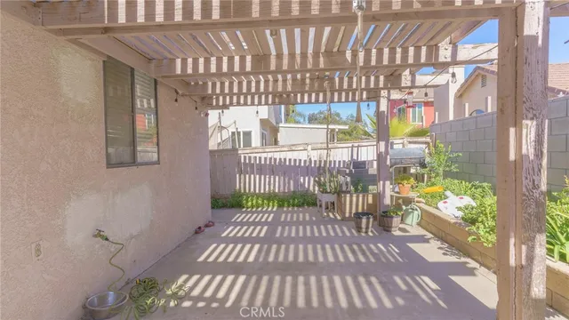 a view of a balcony with wooden floor