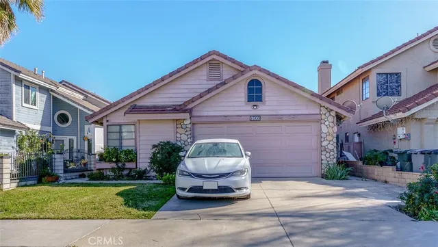 a car parked in front of a house