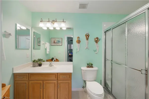 a bathroom with a sink a mirror and a toilet