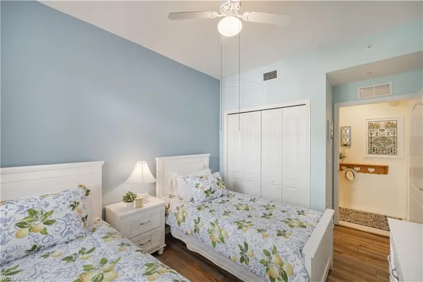 a bedroom with double bed and a window