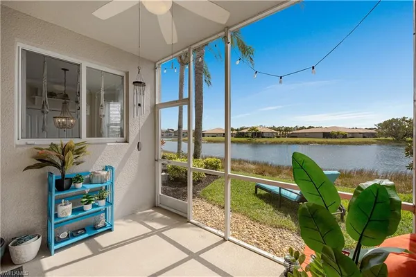 a view of a house with a yard and a fountain