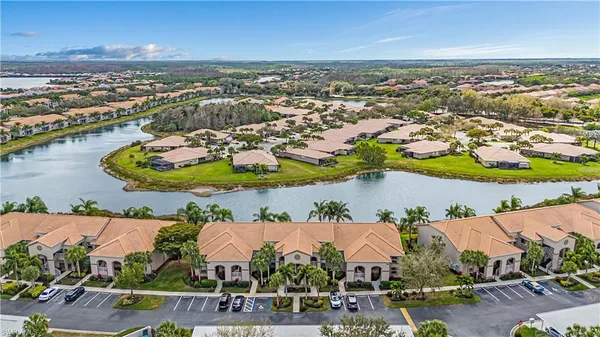 an aerial view of a house with a swimming pool yard and outdoor seating