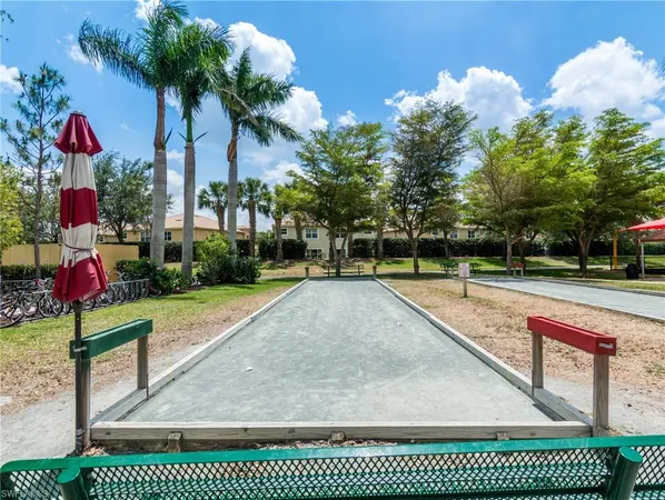 a view of a yard with palm trees