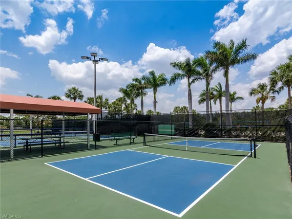 an aerial view of residential houses with outdoor space and swimming pool