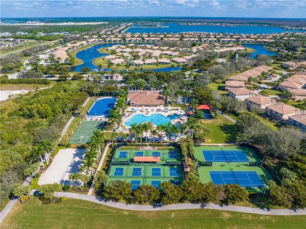 an aerial view of residential houses with outdoor space