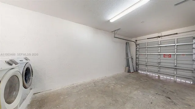 a view of walk in closet with clothes