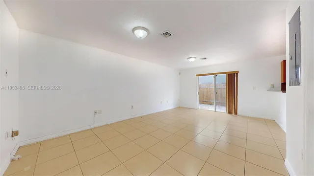 a view of an empty room and window