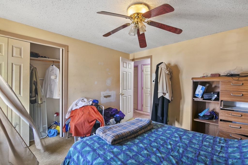 110 Tilton Street Springfield, MA 01109 - Photo 16 of 23 a bedroom with furniture and a window