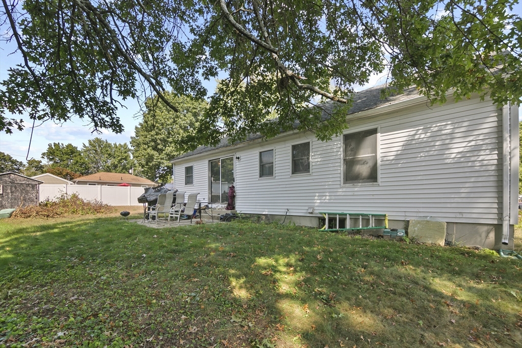 110 Tilton Street Springfield, MA 01109 - Photo 21 of 23 a view of a house with a yard and sitting area