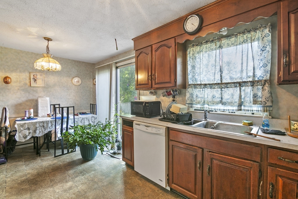 110 Tilton Street Springfield, MA 01109 - Photo 3 of 23 a kitchen with a sink cabinets and window