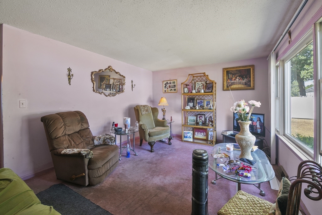 110 Tilton Street Springfield, MA 01109 - Photo 7 of 23 a living room with furniture toys and window