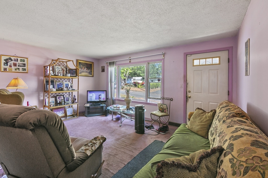 110 Tilton Street Springfield, MA 01109 - Photo 8 of 23 a living room with furniture and a window