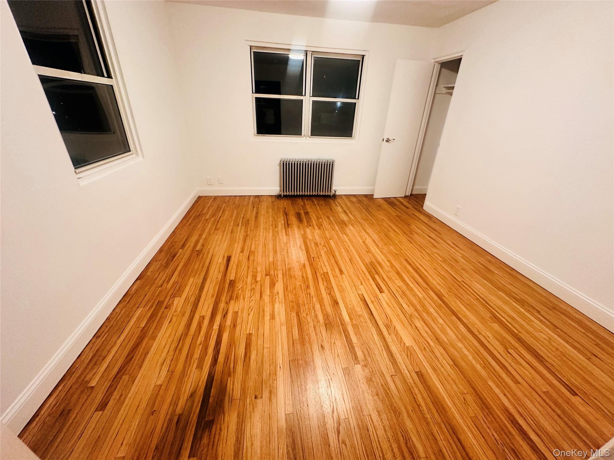 1003 Rottkamp Street, Unit 1 Valley Stream, NY 11580 - Photo 11 of 12 a view of wooden floor in a room